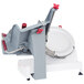 A Berkel manual meat slicer with a red handle and grey machine.