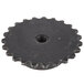 A black sprocket with a hole in the middle.
