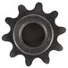 A close-up of a black metal sprocket with a hole in it.