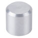 A close-up of a silver cylinder with a round silver knob on top.