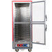 A red and silver Metro C5 holding and proofing cabinet with clear Dutch doors open.