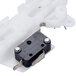 The white plastic actuator switch and bracket for a Waring drink mixer.