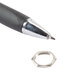 A Waring hex nut next to a black pen with a ring on it.