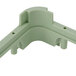A light green plastic Vollrath extender corner piece.
