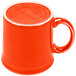 A close-up of a Fiesta Poppy china java mug with an orange handle.