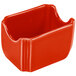 A red ceramic Fiesta sugar caddy with a lid on a counter.