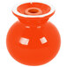 An orange and white Fiesta salt and pepper shaker set with a white lid.
