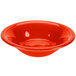 A red Fiesta stacking china bowl with a white background.