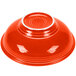 A red Fiesta pedestal serving bowl with a white rim.