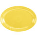 A yellow oval platter with a white background.