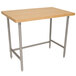An Advance Tabco wood top work table with a stainless steel base.
