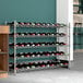 A Regency wire wine rack with bottles on it.