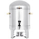 A stainless steel Vollrath coffee urn with brass trim and a black handle.
