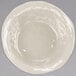 A GET ivory melamine round catering bowl with a white liquid inside.