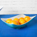 A Keywest Seabreeze melamine bowl filled with oranges.