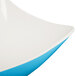 A close up of a white and blue GET Keywest melamine bowl with a white rim.