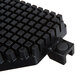 A black plastic square pusher insert for a fruit and vegetable cutter.
