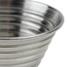 A close up of a stainless steel American Metalcraft round ribbed sauce cup.
