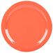A close up of a Carlisle Sunset Orange melamine plate.