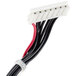 A white and black cable with red and black wires connected to a Waring switch panel.