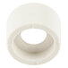A white plastic Waring housing seal with a hole.