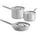 Vollrath stainless steel cookware set with lids, including three pots and pans.