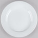 A close-up of a CAC porcelain plate with a white rim.