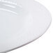 A close-up of a CAC Boston Super Bright White Porcelain Platter with a pattern on it.