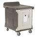 A brown and gray Cambro meal delivery cart with a large plastic container on wheels.