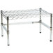 A chrome plated wire dunnage rack with a metal frame and black legs.