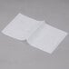 Durable Packaging Bakery Tissue paper folded on a gray surface.