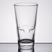 A close-up of a Libbey stackable beverage glass on a table.