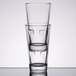Two clear Libbey Optiva beverage glasses stacked on top of a stack of them.