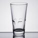 A Libbey stackable beverage glass with a design on it.