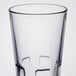 A clear Libbey stackable beverage glass with a small black rim.