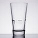 A close-up of a Libbey stackable beverage glass.
