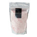 A bag of Rokz peppermint cocktail rimming sugar with white and pink sugar.