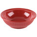 A close up of a red GET Geneva bowl with a rippled design.