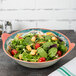 A Bella Fresco melamine bowl filled with salad with tomatoes and croutons.