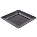 A black square GET Milano melamine plate with a silver rim.