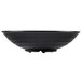 A black round melamine bowl with a white background.