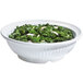 A white Geneva melamine bowl filled with kale salad.