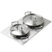 A Vollrath stainless steel adapter plate with two casserole pans on a tray.