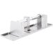 A stainless steel Bobrick multi roll toilet paper dispenser with a metal handle.
