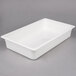 A white rectangular Cambro plastic food pan with a lid.