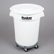 A white plastic Continental trash can with wheels and a lid.