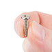 A person holding a Waring screw.