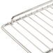 An Avantco stainless steel wire rack with a handle.