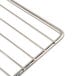 A stainless steel wire rack with a handle.