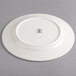 A Homer Laughlin Kensington Ameriwhite bright white china plate with a small design on it.